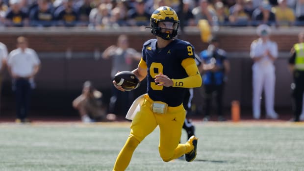 Sep 23, 2023; Ann Arbor, Michigan, USA; Michigan Wolverines quarterback J.J. McCarthy (9) runs the ball against the Rutgers Scarlet Knights in the first half at Michigan Stadium. Mandatory Credit: Rick Osentoski-USA TODAY Sports