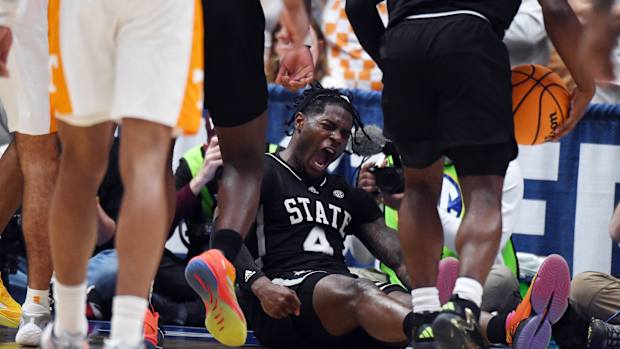 Mar 15, 2024; Nashville, TN, USA; Mississippi State Bulldogs forward Cameron Matthews (4) celebrates after a basket during the first half against the Tennessee Volunteers at Bridgestone Arena. Mandatory Credit: Christopher Hanewinckel-USA TODAY Sports
