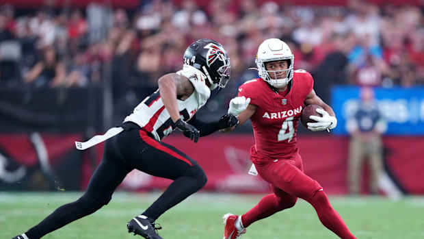 Nov 12, 2023; Glendale, Arizona, USA; Arizona Cardinals wide receiver Rondale Moore (4) runs against Atlanta Falcons cornerback A.J. Terrell (24) during the first half at State Farm Stadium.