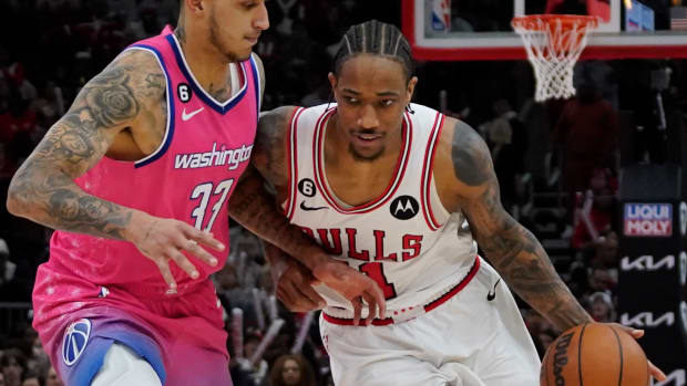 Feb 26, 2023; Chicago, Illinois, USA; Washington Wizards forward Kyle Kuzma (33) defends Chicago Bulls forward DeMar DeRozan (11) during the second half at United Center. Mandatory Credit: David Banks-USA TODAY Sports