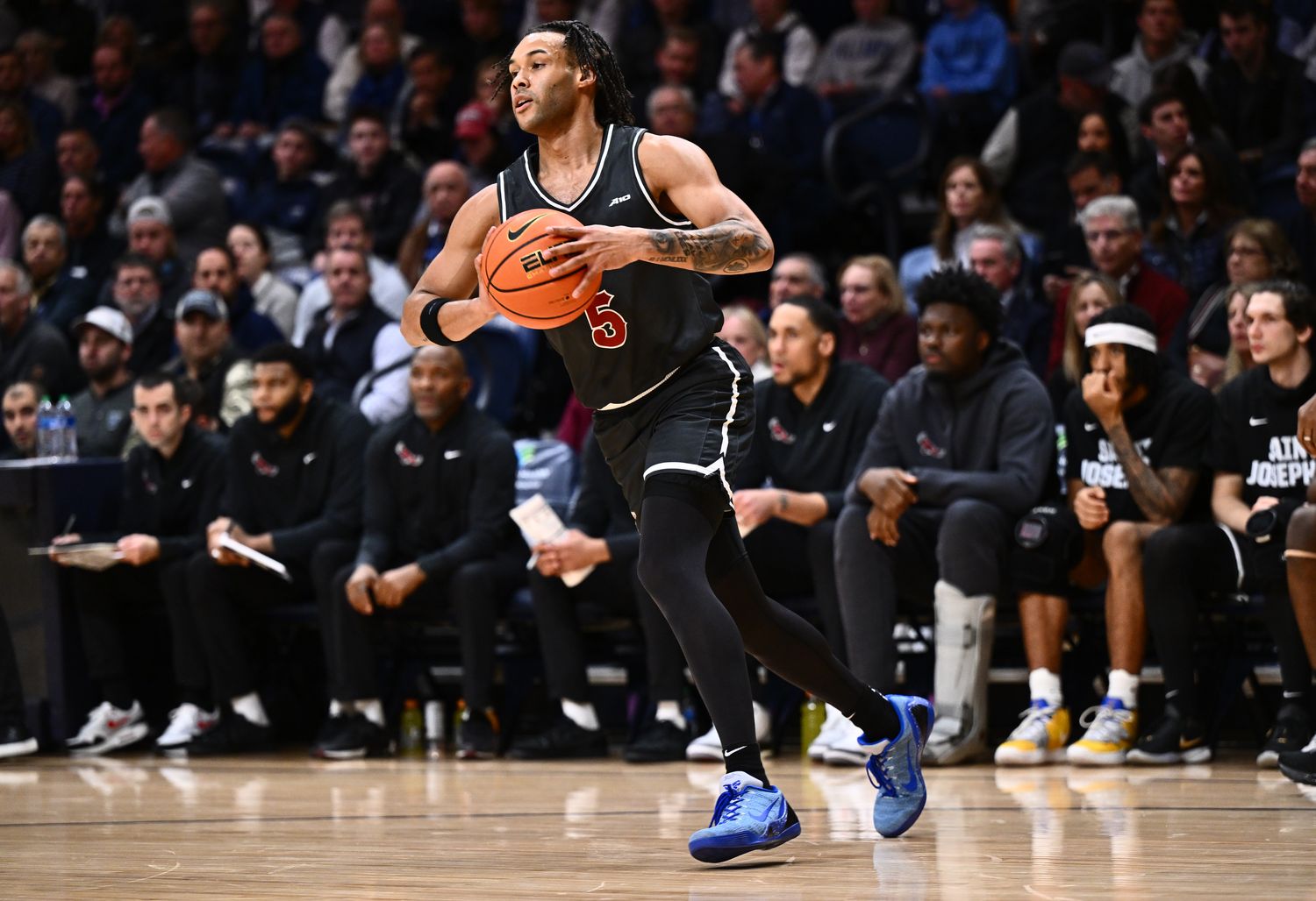 Nov 29, 2023; Villanova, Pennsylvania, USA; Saint Joseph's Hawks guard Lynn Greer III (5) passes the ball against the Villanova Wildcats in the first half at William B. Finneran Pavilion. 