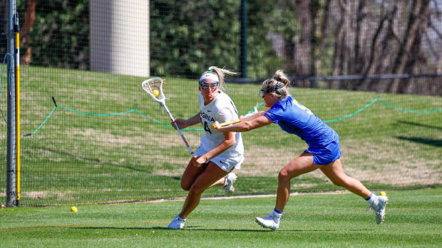 Morgan Schwab dodges with the ball during the Virginia women's lacrosse game against Pittsburgh at Klockner Stadium.