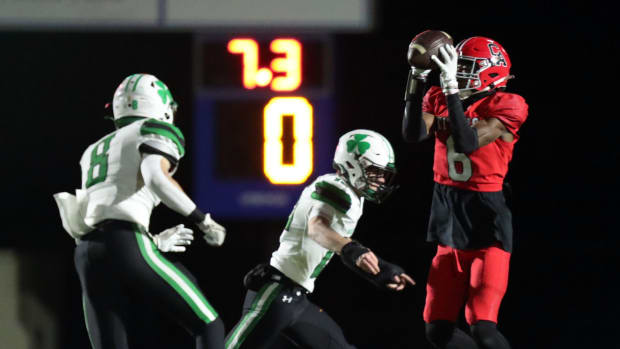 Andrew Elder knocks the ball loose from Trystan Haynes in a state championship semi-final as Carl Albert plays McGuiness on Nov 24, 2023; Noble, Oklahoma, USA; at Noble High School. Mandatory Credit: Steve Sisney-The Oklahoman
