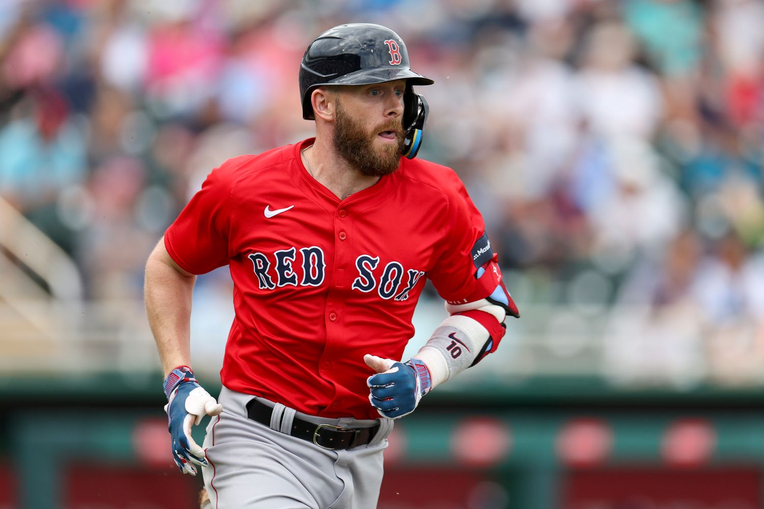 Mar 6, 2024; Fort Myers, Florida, USA; Boston Red Sox shortstop Trevor Story (10) singles against the Minnesota Twins in the sixth inning at Hammond Stadium.