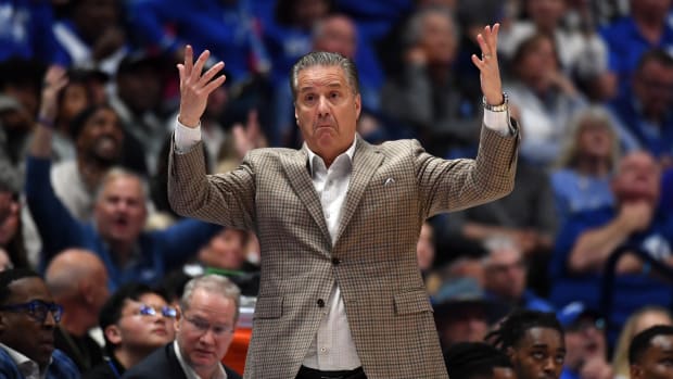 Mar 15, 2024; Nashville, TN, USA; Kentucky Wildcats head coach John Calipari questions a call during the first half against the Texas A&M Aggies at Bridgestone Arena. Mandatory Credit: Christopher Hanewinckel-USA TODAY Sports
