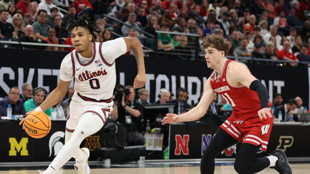 Illinois guard Terrence Shannon Jr. (0) plays the ball in the second half against Wisconsin at Target Center in Minneapolis on March 17, 2024.