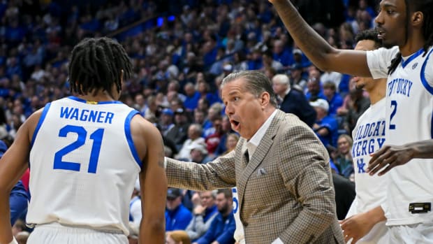 Mar 15, 2024; Nashville, TN, USA; Kentucky Wildcats head coach John Calipari talks with guard D.J. Wagner (21) during the first half at Bridgestone Arena. Mandatory Credit: Steve Roberts-USA TODAY Sports