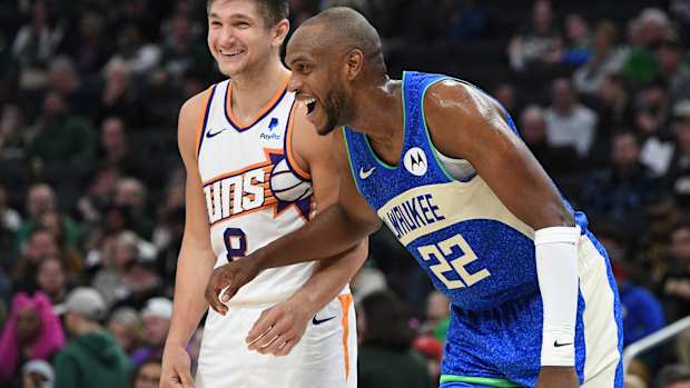  Phoenix Suns guard Grayson Allen (8) and former teammate Milwaukee Bucks forward Khris Middleton (22)