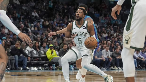 Milwaukee Bucks guard Malik Beasley (5) handles the ball against the Charlotte Hornets 