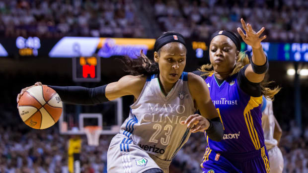 Oct 4, 2017; Minneapolis, MN, USA; Minnesota Lynx forward Maya Moore (23) dribbles in the first quarter against the Los Angeles Sparks guard Odyssey Sims (1) in Game 5 of the WNBA Finals at Williams Arena.