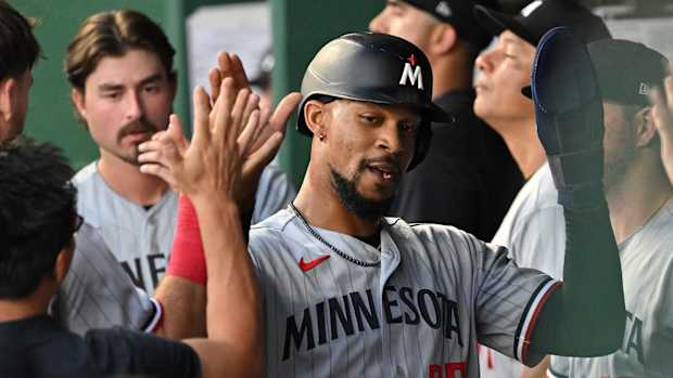 Jul 29, 2023; Kansas City, Missouri, USA; Minnesota Twins designated hitter Byron Buxton (25) celebrates in the dugout after scoring a run during the sixth inning against the Kansas City Royals at Kauffman Stadium.