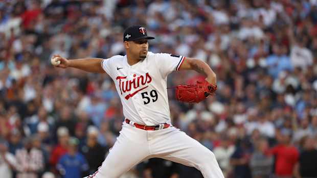 Oct 4, 2023; Minneapolis, Minnesota, USA; Minnesota Twins relief pitcher Jhoan Duran (59) delivers a pitch in the ninth inning against the Toronto Blue Jays during game two of the Wildcard series for the 2023 MLB playoffs at Target Field.