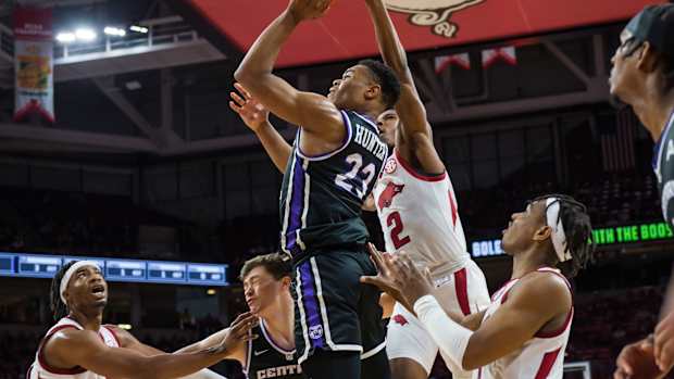 Dec 1, 2021; Fayetteville, Arkansas, USA; Arkansas Razorbacks guard Khalen Robinson (2) tries to block a shot by Central Arkansas Bears guard Camren Hunter (23) during the first half at Bud Walton Arena. Mandatory Credit: Brett Rojo-USA TODAY Sports