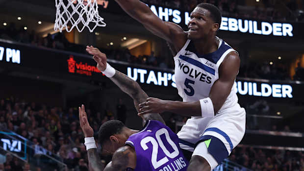 Minnesota Timberwolves’ Anthony Edwards dunks on Utah Jazz forward John Collins.