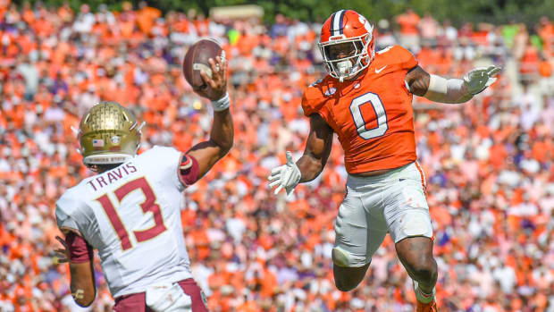 Clemson defender Barrett Carter pressures Florida State quarterback Jordan Travis on a throw.