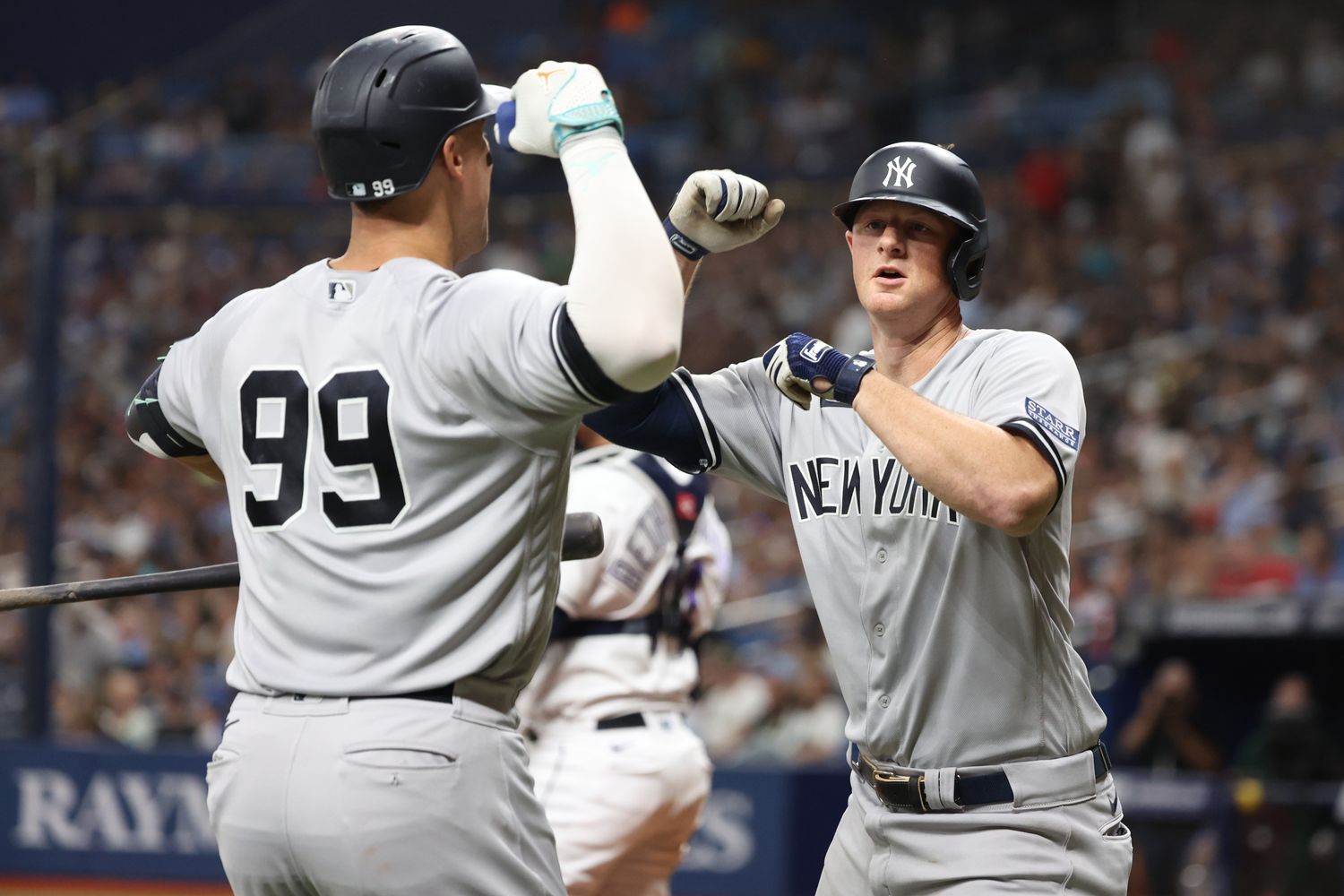 Aug 25, 2023; St. Petersburg, Florida, USA; New York Yankees third baseman DJ LeMahieu (26) is congratulated by right fielder Aaron Judge (99) after he hit a home run against the Tampa Bay Rays during the eighth inning at Tropicana Field. Mandatory Credit: Kim Klement Neitzel-USA TODAY Sports