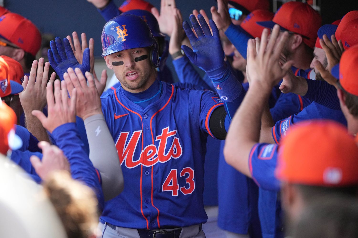 Feb 26, 2024; West Palm Beach, Florida, USA; New York Mets left fielder Trayce Thompson (43) is congratulated by teammates after hitting a grand slam against the Washington Nationals in the third inning at CACTI Park of the Palm Beaches. Mandatory Credit: Jim Rassol-USA TODAY Sports