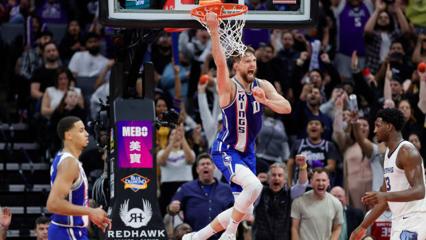 Mar 18, 2024; Sacramento, California, USA; Sacramento Kings forward Domantas Sabonis (10) celebrates after scoring a basket during overtime against the Memphis Grizzlies at Golden 1 Center. Mandatory Credit: Sergio Estrada-USA TODAY Sports