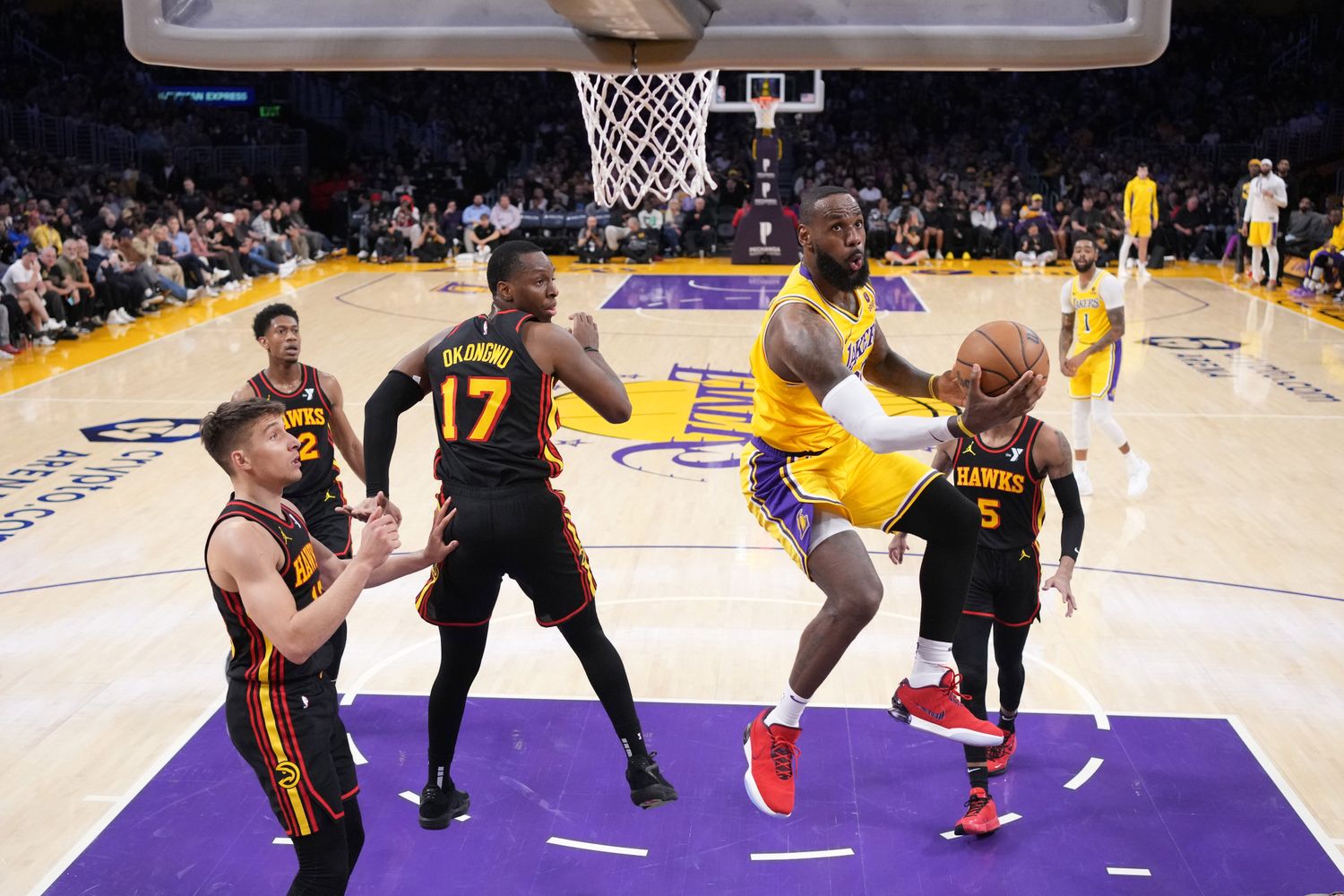 Mar 18, 2024; Los Angeles, California, USA; Los Angeles Lakers forward LeBron James (23) shoots the ball against Atlanta Hawks forward Onyeka Okongwu (17) in the second half at Crypto.com Arena. Mandatory Credit: Kirby Lee-USA TODAY Sports