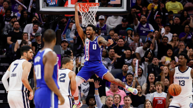 Mar 18, 2024; Sacramento, California, USA; Sacramento Kings guard Malik Monk (0) dunks the ball during the fourth quarter against the Memphis Grizzlies at Golden 1 Center. Mandatory Credit: Sergio Estrada-USA TODAY Sports