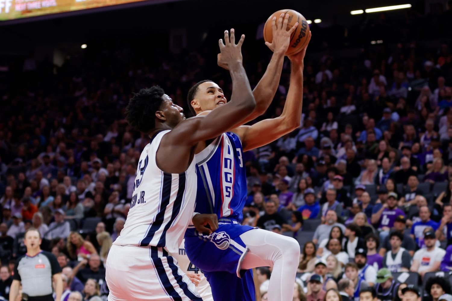 Mar 18, 2024; Sacramento, California, USA; Sacramento Kings forward Keegan Murray (13) drives to the basket against Memphis Grizzlies forward Jaren Jackson Jr. (13) during the second quarter at Golden 1 Center. Mandatory Credit: Sergio Estrada-USA TODAY Sports