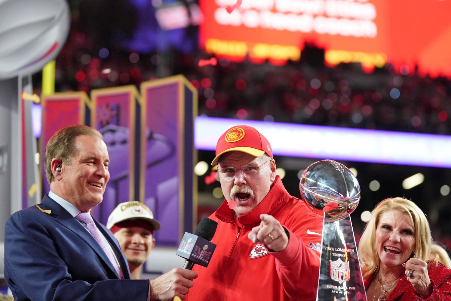 Feb 11, 2024; Paradise, Nevada, USA; Kansas City Chiefs head coach Andy Reid celebrates while being interviewed by CBS commentator Jim Nantz after winning Super Bowl LVIII against the San Francisco 49ers at Allegiant Stadium.