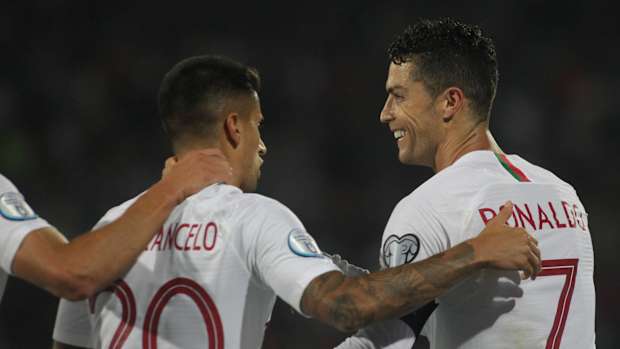 Joao Cancelo (left) and Cristiano Ronaldo pictured during Portugal's 4-2 win over Serbia in September 2019