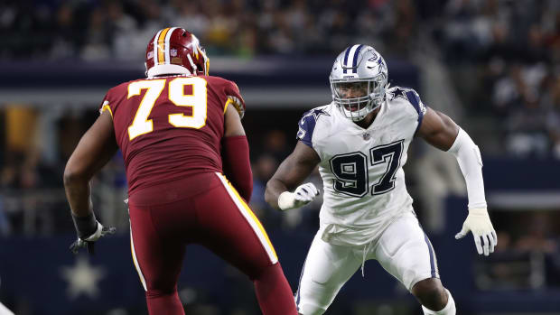 Nov 30, 2017; Arlington, TX, USA; Dallas Cowboys defensive end Taco Charlton (97) rushes the passer against Washington Redskins tackle Ty Nsekhe (79) at AT&T Stadium. Mandatory Credit: Matthew Emmons-USA TODAY Sports  