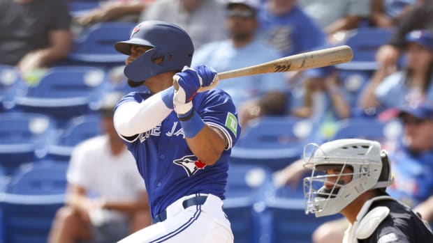 Mar 12, 2024; Dunedin, Florida, USA; Toronto Blue Jays second baseman Santiago Espinal (5) hits a two rbi double against the New York Yankees in the fifth inning at TD Ballpark. Mandatory Credit: Nathan Ray Seebeck-USA TODAY Sports  