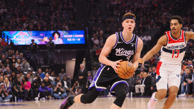 Sacramento Kings forward/guard Kevin Huerter (9) drives in against Washington Wizards guard Jordan Poole (13) during the first quarter at Golden 1 Center.
