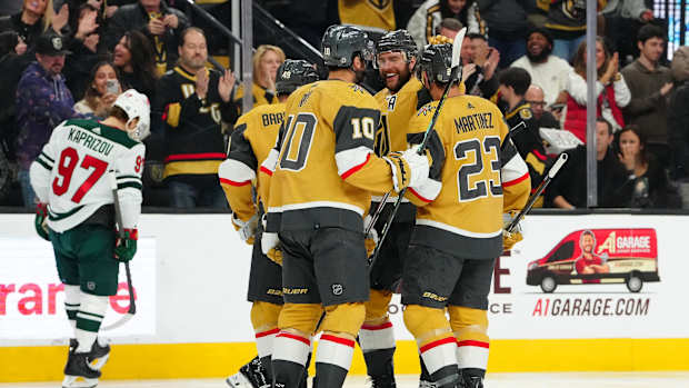 Feb 12, 2024; Las Vegas, Nevada, USA; Vegas Golden Knights right wing Jonathan Marchessault (81) celebrates with teammates after scoring a goal against the Minnesota Wild during the first period at T-Mobile Arena.