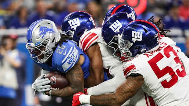 Detroit Lions tight end Sam LaPorta (87) makes a pass against New York Giants safety Jason Pinnock (27) during the first half of a preseason at Ford Field in Detroit on Friday, Aug. 11, 2023.