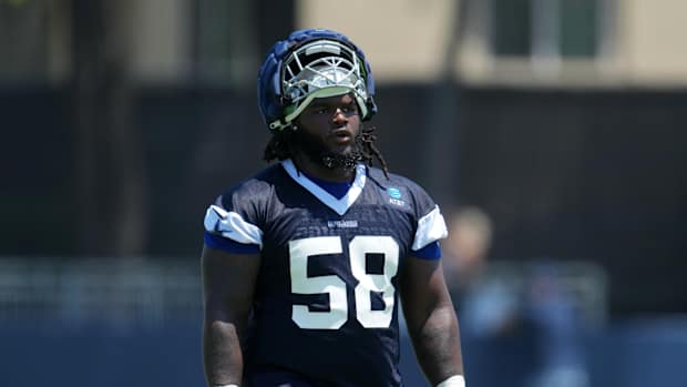 Jul 29, 2023; Oxnard, CA, USA; Dallas Cowboys defensive tackle Mazi Smith (58) wears a Guardian helmet cap during training camp at the River Ridge Fields. Mandatory Credit: Kirby Lee-USA TODAY Sports