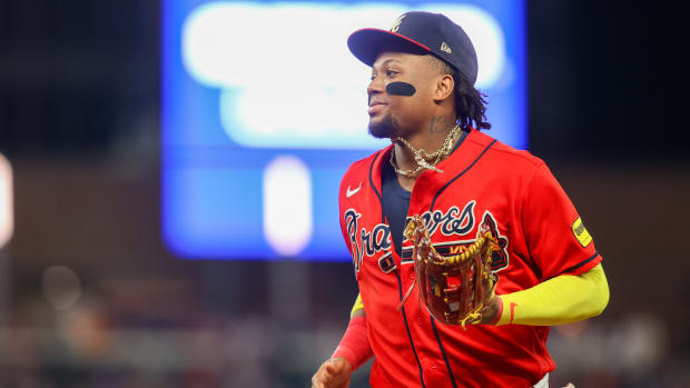 Aug 18, 2023; Atlanta, Georgia, USA; Atlanta Braves right fielder Ronald Acuna Jr. (13) runs to the dugout to change gloves against the San Francisco Giants in the ninth inning at Truist Park.