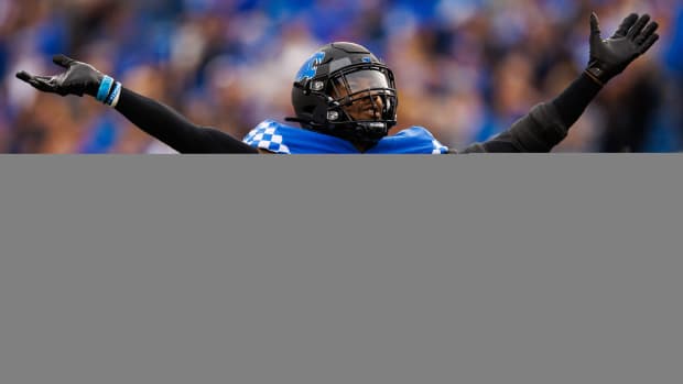 Nov 26, 2022; Lexington, Kentucky, USA; Kentucky Wildcats linebacker J.J. Weaver (13) celebrates during the first quarter against the Louisville Cardinals at Kroger Field. Mandatory Credit: Jordan Prather-USA TODAY Sports