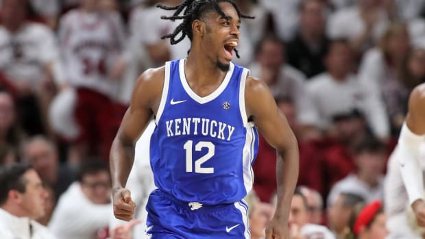 Mar 4, 2023; Fayetteville, Arkansas, USA; Kentucky Wildcats guard Antonio Reeves (12) reacts after scoring in the first in the second half against the Arkansas Razorbacks at Bud Walton Arena. Kentucky won 88-79. Mandatory Credit: Nelson Chenault-USA TODAY Sports