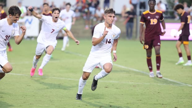 Daniel Mangarov celebrates after scoring the game-winning goal during the Virginia men's soccer match against Iona.