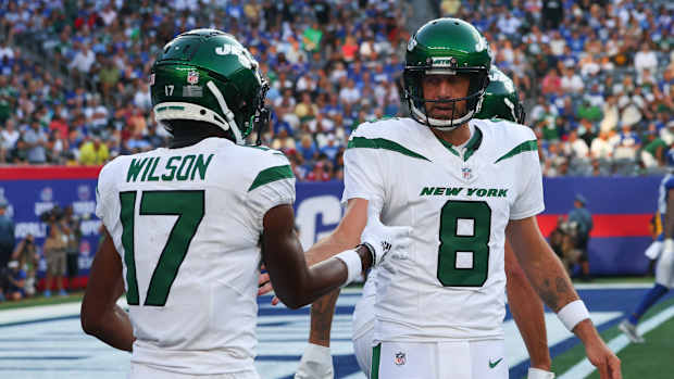 QB Aaron Rodgers (8) and WR Garrett Wilson (17) celebrate their TD against the Giants