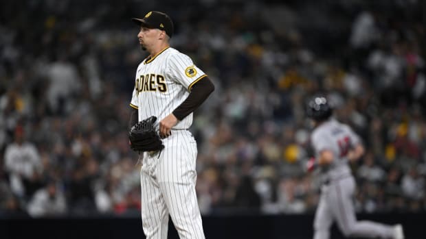Apr 18, 2023; San Diego, California, USA; San Diego Padres starting pitcher Blake Snell (left) looks on as Atlanta Braves catcher Sean Murphy (12) rounds the bases after hitting a home run during the fourth inning at Petco Park.