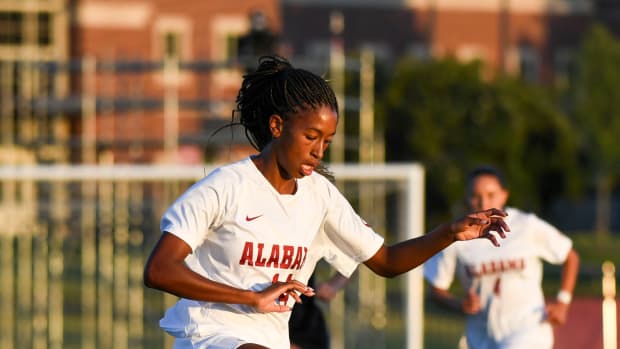 Alabama forward Gianna Paul (14) moves the ball upfield against DePaul. The Alabama Crimson Tide soccer team opened the 2023 season against DePaul Thursday, Aug. 17, 2023.  