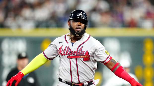 Aug 30, 2023; Denver, Colorado, USA; Atlanta Braves designated hitter Marcell Ozuna (20) celebrates his solo home run in the sixth inning against the Colorado Rockies at Coors Field.