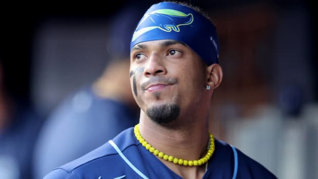 Rays shortstop Wander Franco looks on while in the dugout during a game.