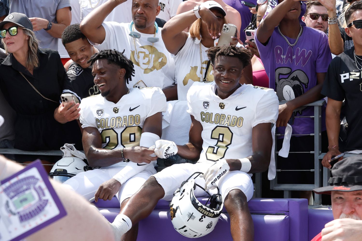 Colorado Buffaloes safety Rodrick Ward (29) and running back Dylan Edwards (3) celebrate with fans after the game against the TCU Horned Frogs at Amon G. Carter Stadium