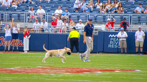 Juice Kiffin retrieving kickoff tee. 