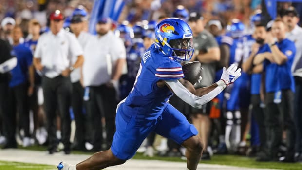 Sep 1, 2023; Lawrence, Kansas, USA; Kansas Jayhawks running back Devin Neal (4) runs for touchdown during the second half against the Missouri State Bears at David Booth Kansas Memorial Stadium.