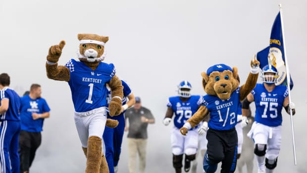 Sep 3, 2022; Lexington, Kentucky, USA; The Kentucky Wildcats mascots run onto the field before the game against the Miami (Oh) Redhawks at Kroger Field. Mandatory Credit: Jordan Prather-USA TODAY Sports