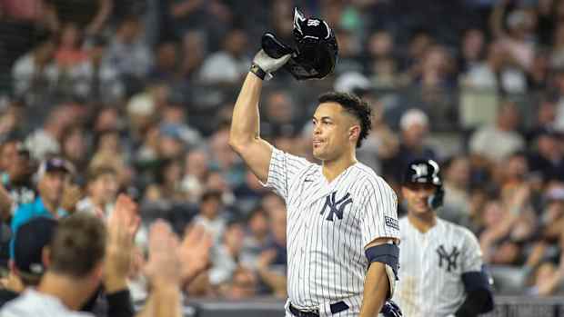 Yankees DH Giancarlo Stanton celebrates after hitting his 400th home run.