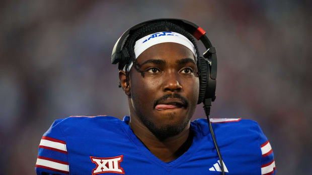 Sep 1, 2023; Lawrence, Kansas, USA; Kansas Jayhawks quarterback Jalon Daniels (6) during a timeout in the first half against the Missouri State Bears at David Booth Kansas Memorial Stadium. Mandatory Credit: Jay Biggerstaff-USA TODAY Sports  