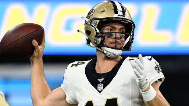 Saints rookie quarterback Jake Haener throws a pass during a preseason game.