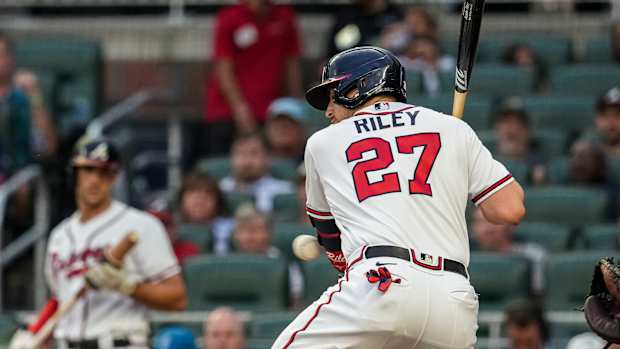 Sep 6, 2023; Cumberland, Georgia, USA; Atlanta Braves third baseman Austin Riley (27) is hit by a pitch against the St. Louis Cardinals during the first inning at Truist Park. Mandatory Credit: Dale Zanine-USA TODAY Sports  